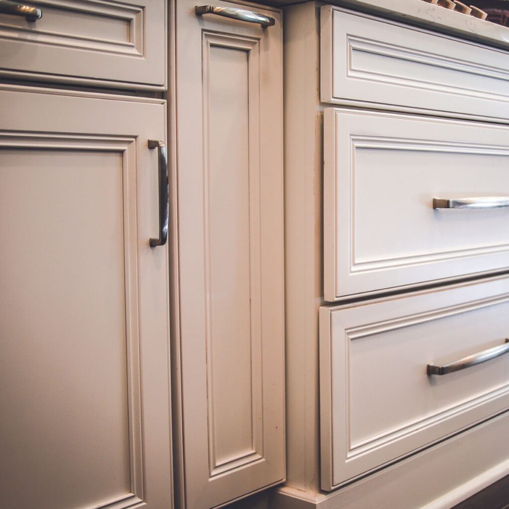 closeup of white cabinets with silver handles