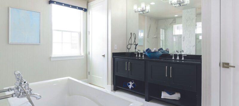 white modern and simple bathroom with dark brown double sink cabinets